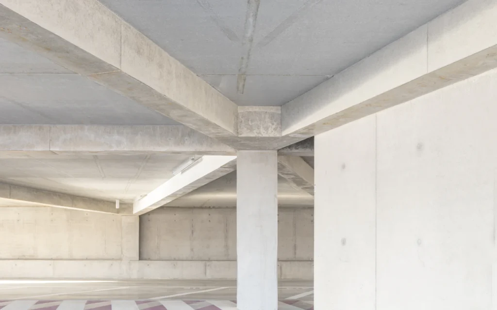 Parking garage deck with a coated wearing surface and freshly painted stripes after a traffic coating installation